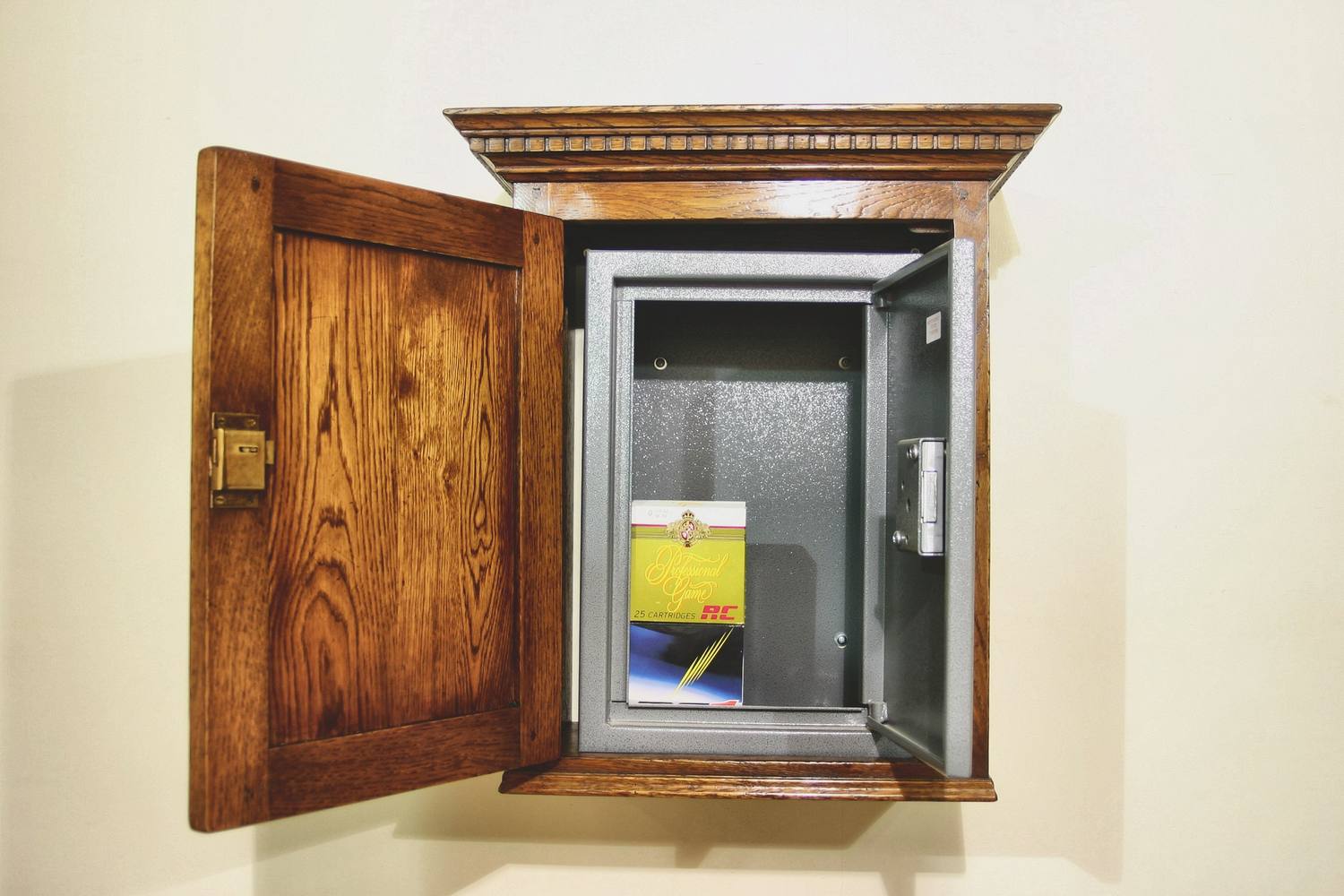 Ammunition cabinets built as separately locked compartments, timber door open to show the steel door behind