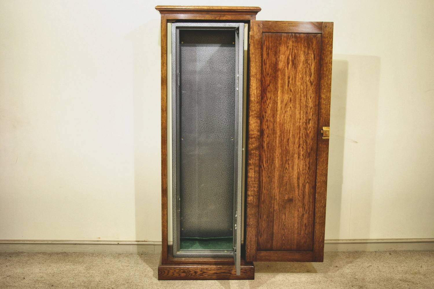 Freestanding gun cabinets in oak, with the timber door and the steel door both open