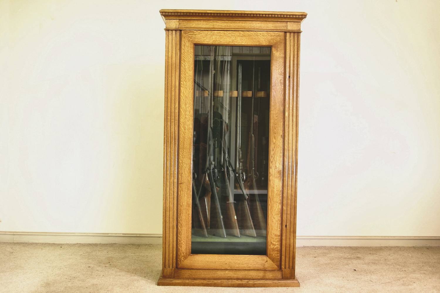 What gun cabinet prices buy: a glazed oak cabinet, made and finished in Suffolk