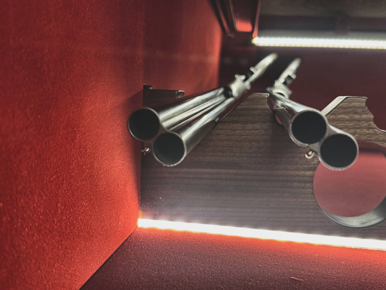 Gun room ventilation and lighting: interior light aimed at the rack rather than at the glass