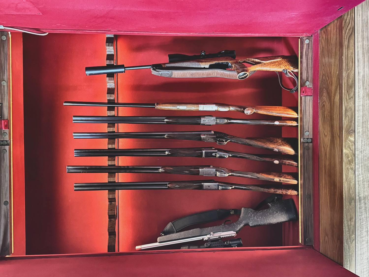 Racks drawn from a real gun list: baize-lined, cut to the guns, nothing touching