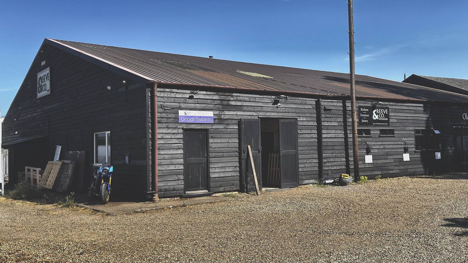 The moulder in the machine shop, with timber stacked alongside