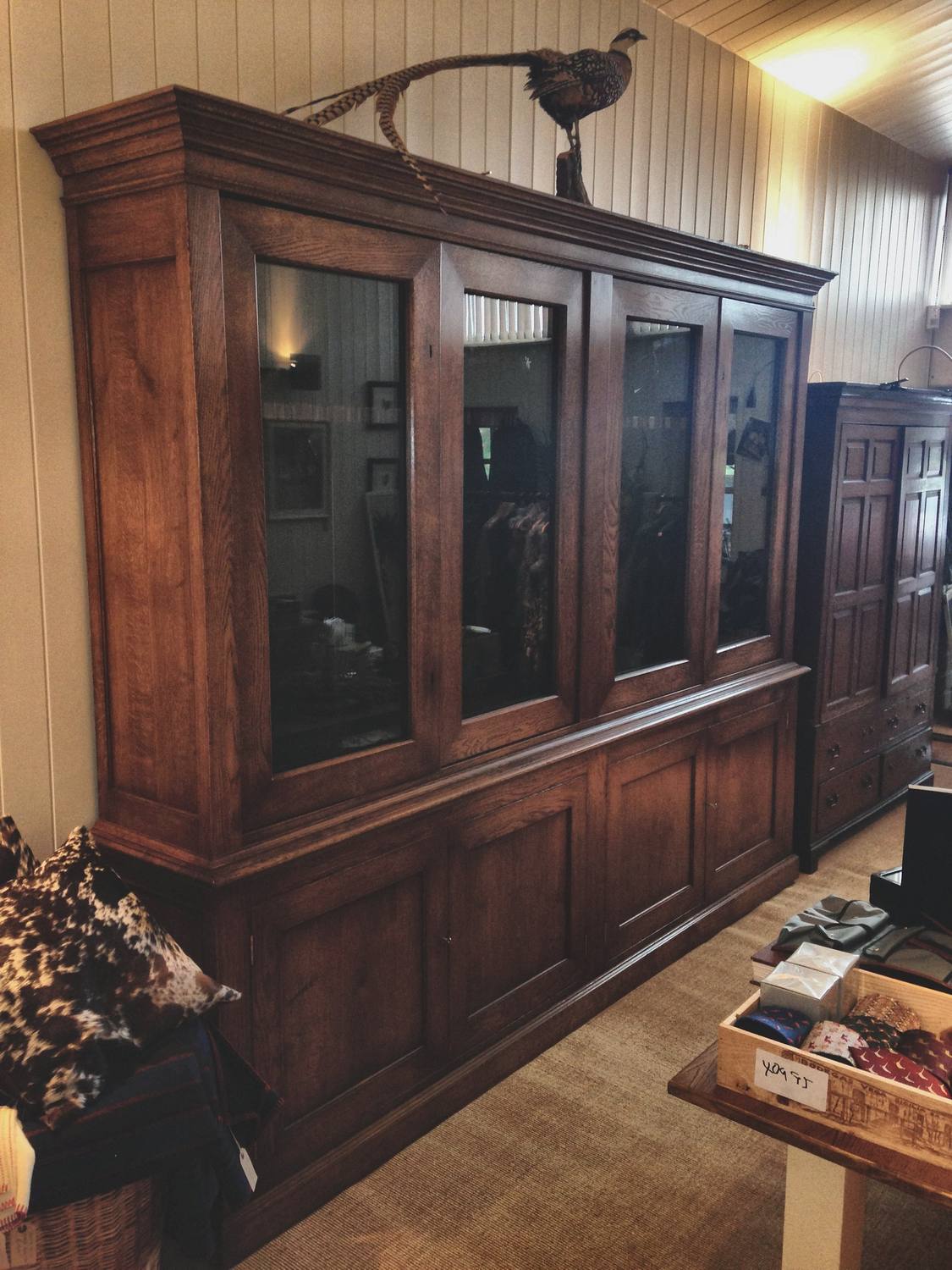 Large gun rooms: multi-bay glazed cabinetry with independent locking per bay