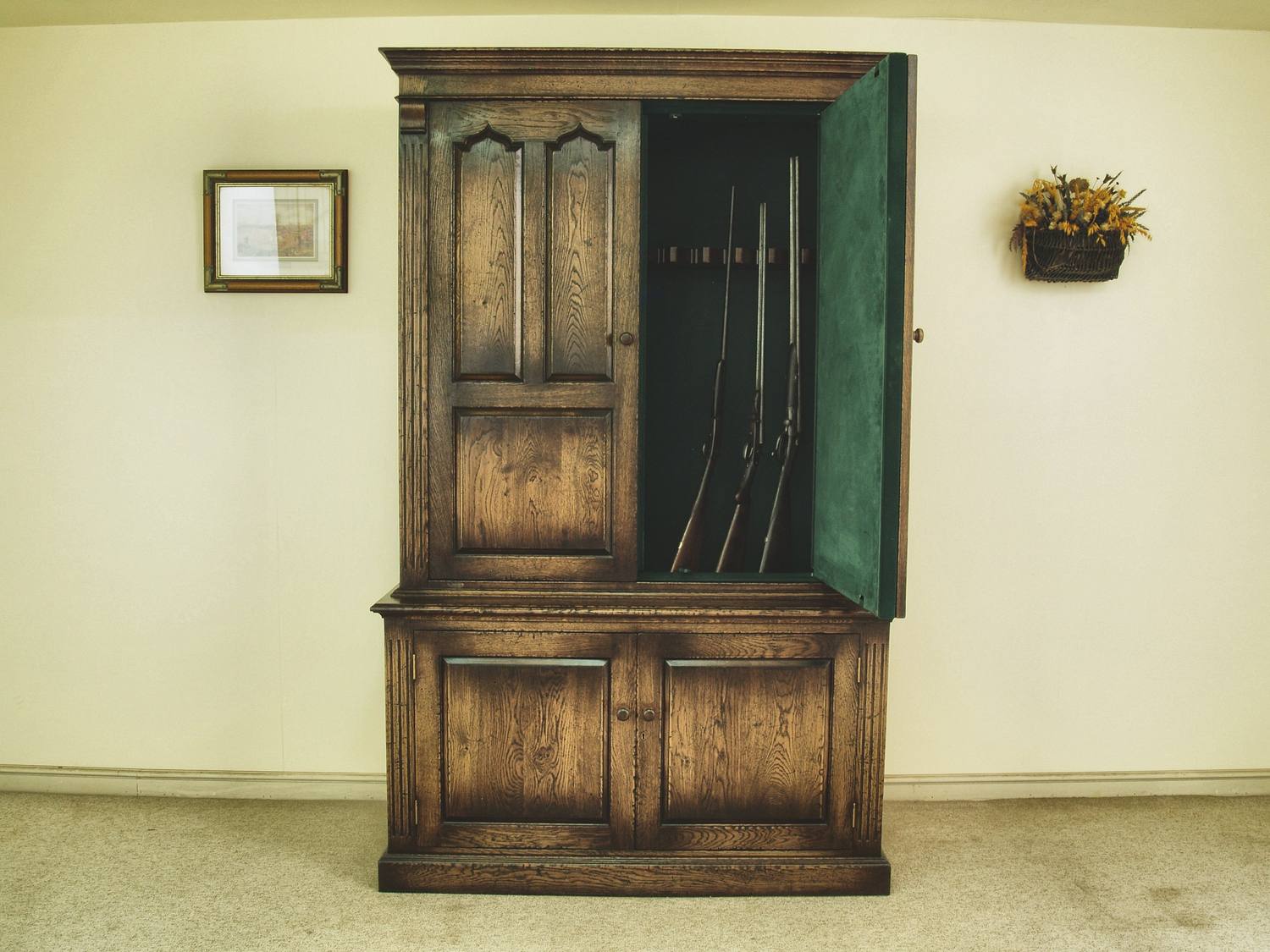 Gun cabinet humidity in practice: a panelled cabinet open, showing the racked and ventilated interior