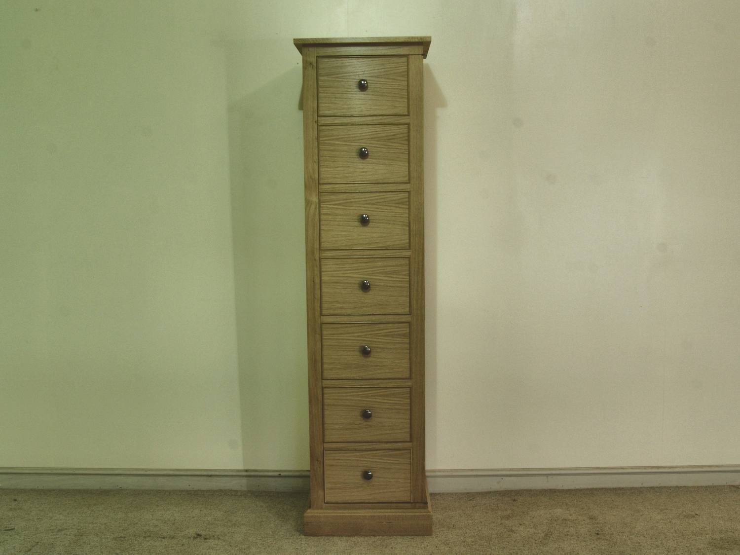 Cartridge storage in a Wellington chest with seven graduated drawers, made in solid oak