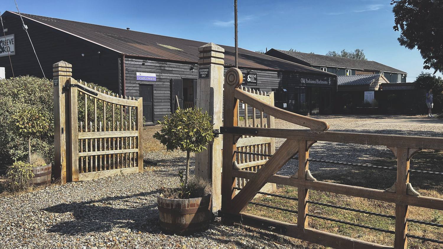 Oak gate and post-and-rail fence at the entrance to the workshop