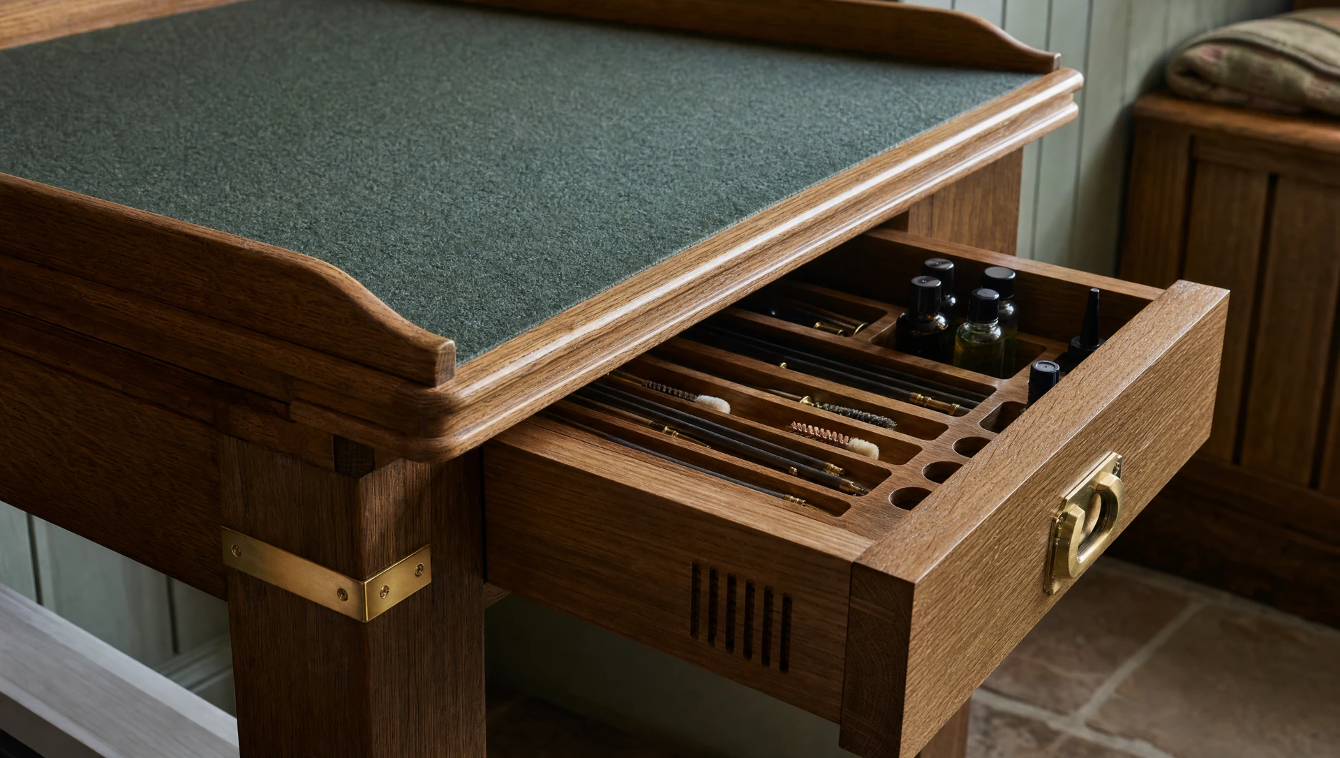 Detail of a cleaning table with the baize top raised and a fitted tool drawer below