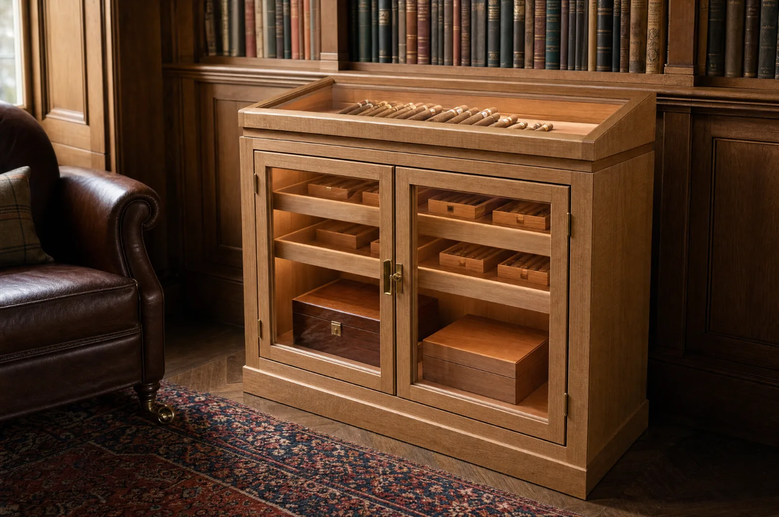 Low cigar cabinet with a sloped glazed display top over glazed doors and sliding cedar trays